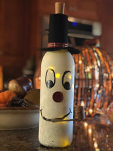 Load image into Gallery viewer, Frosty The Wine-man| Upcycled Wine Bottle come with a battery operated lighted cork| Wine Lover| Wine Decor|Up Cycled Gift| Wine Lover Gift
