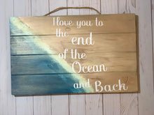 Load image into Gallery viewer, I love you to the end of the Ocean and Back Wood Sign. Beautiful Beach Sign measures 17 in. by 10 1/2 in. Perfect gift for a Ocean lover.
